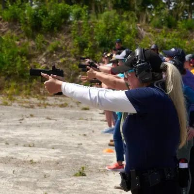 women shooting guns at a range