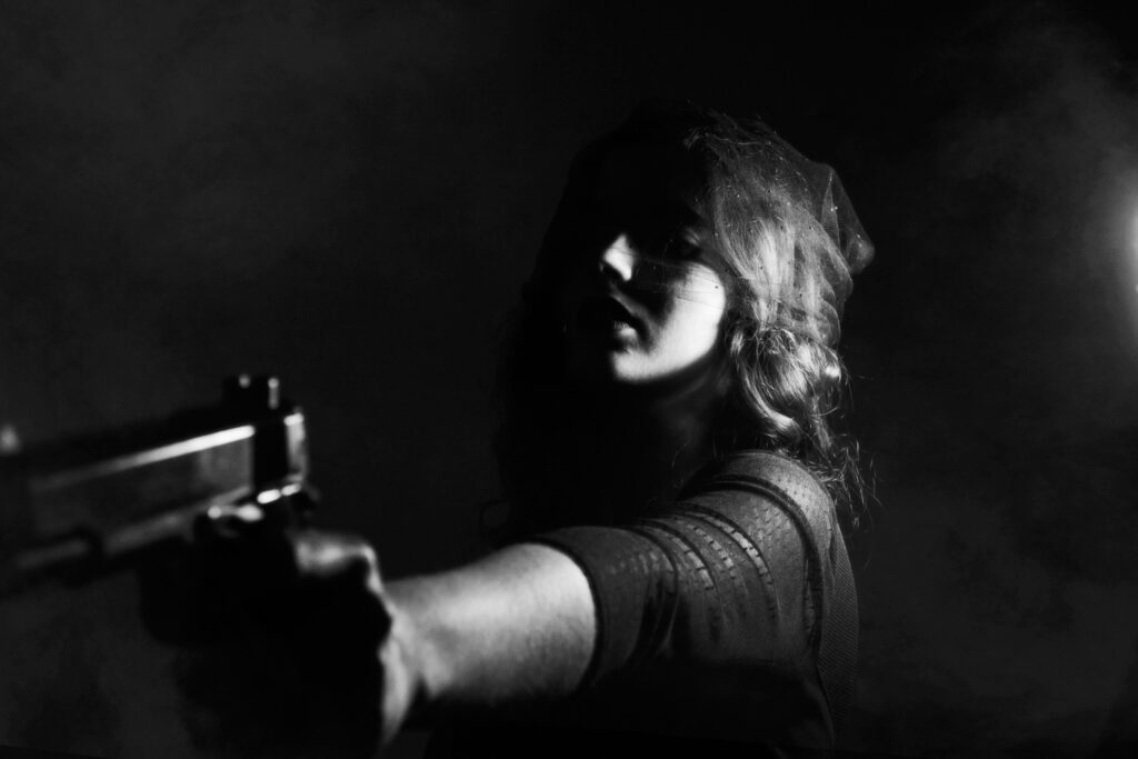 woman pointing a gun