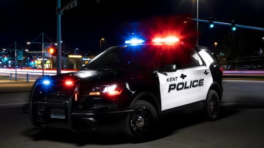 a police car at night with the lights on