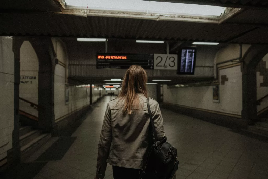 woman walking in a subway station