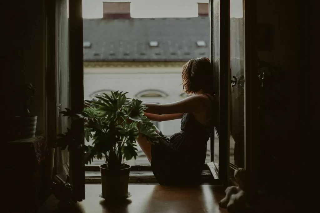 woman sitting by a window