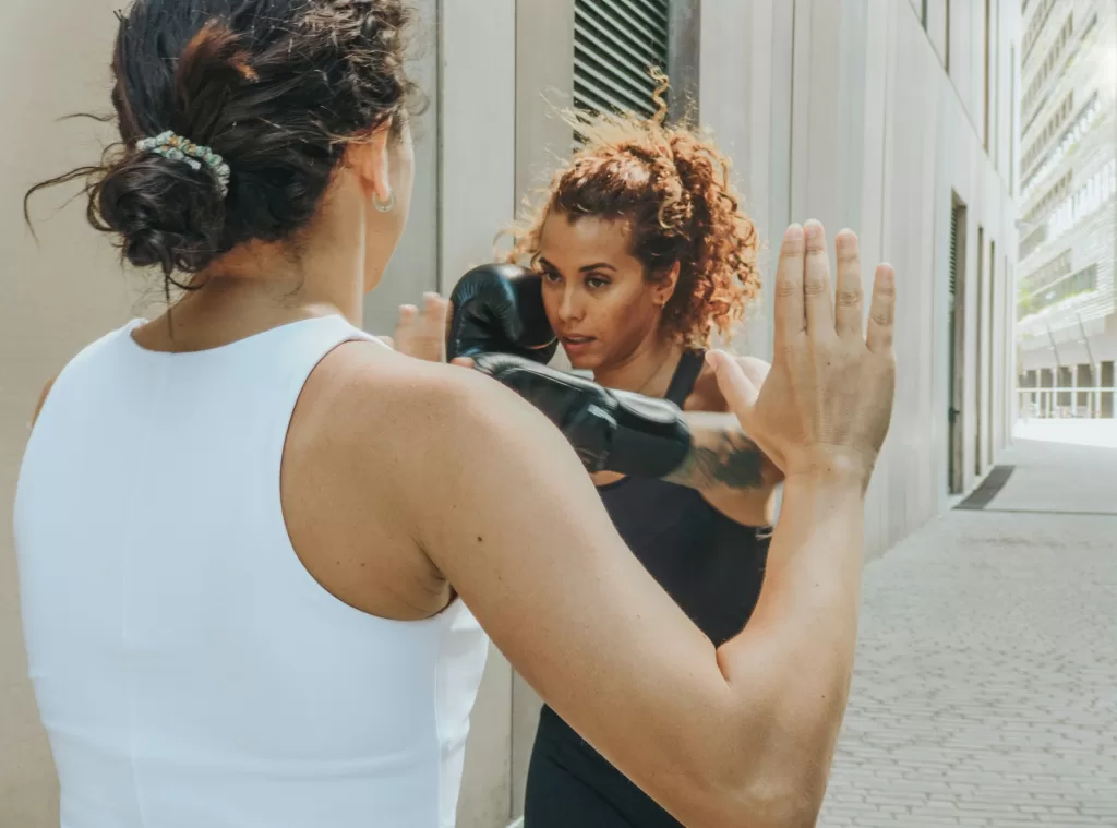 two women sparring togethr